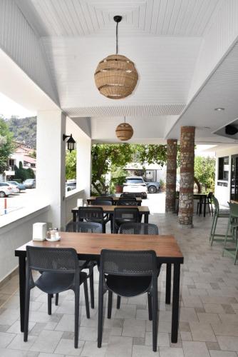 a dining room with a table and chairs at Magic Tulip Hotel in Oludeniz