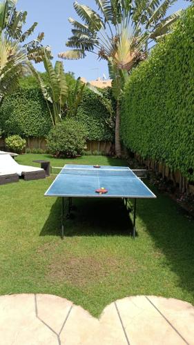 a ping pong table in the middle of a yard at Stella Di Mare Ain Sokhna Beautiful Luxurious Villa in Ain Sokhna