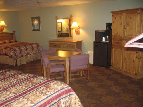 Ein Bett oder Betten in einem Zimmer der Unterkunft New Summit Inn