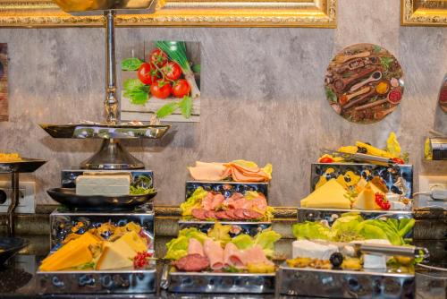 a buffet with many different types of food at Voila Inn Predeal in Predeal