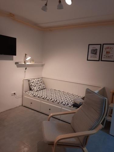 a living room with a couch and a chair at ADA, New Belgrade in Tošin Bunar