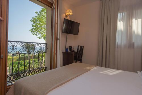 Katil atau katil-katil dalam bilik di Hotel La Portilla