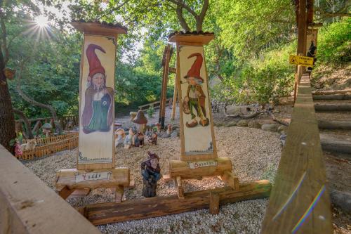 a playground with three pillars in a park at Agriturismo le Fontane - Lago di Bolsena in Grotte di Castro
