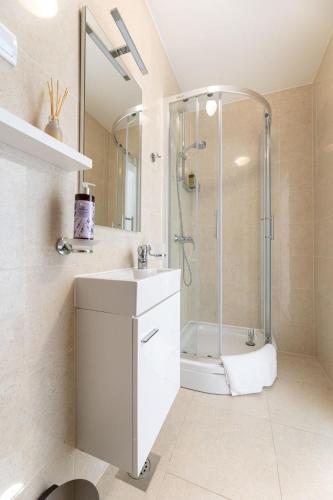 a bathroom with a shower and a sink at Casa Bella in Malinska