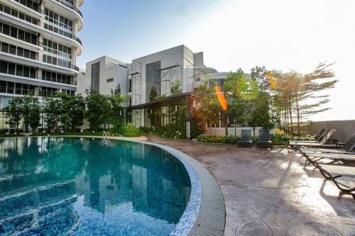 a swimming pool in the middle of a building at 1410Encorp/Bathtud/Netflix/100mbps/Legoland By STAY in Nusajaya