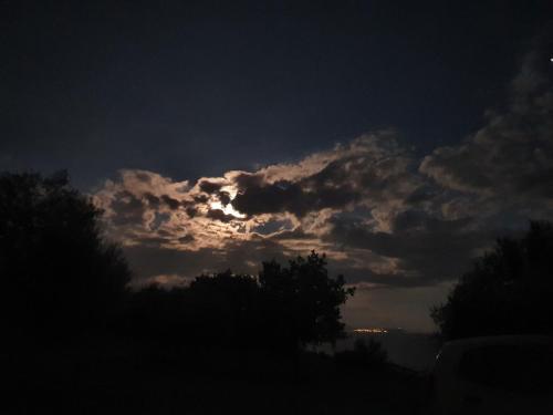 a cloudy sky at night with the sun poking through at Agriturismo Le Terre di Veneré in Acciaroli