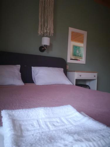 Postel nebo postele na pokoji v ubytování Achillion b&b