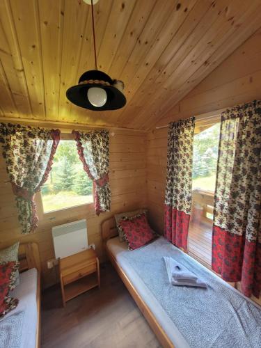Cama ou camas em um quarto em Camping Family