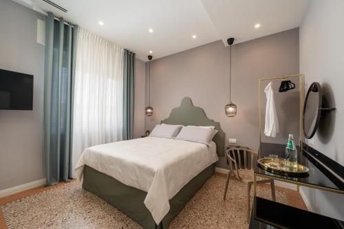 Postel nebo postele na pokoji v ubytování NUE SUITES