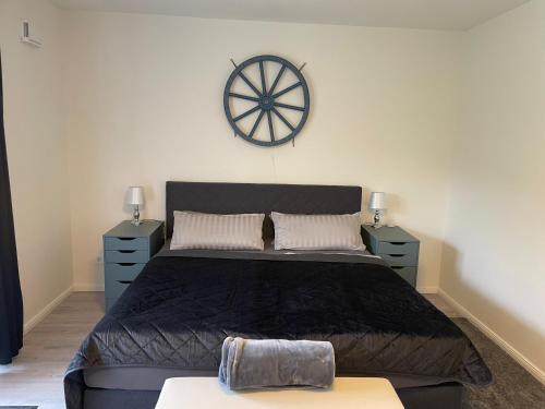 a bedroom with a large bed with two night stands at Pier 67 Neustadt in Neustadt in Holstein