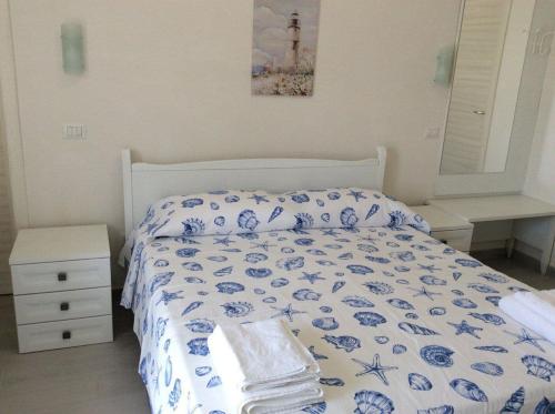 מיטה או מיטות בחדר ב-B&B Il Sorriso di Monica