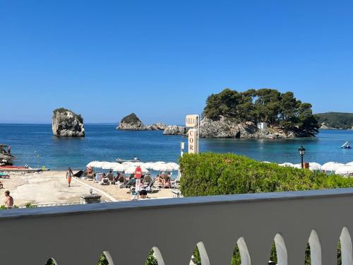 a view of a beach with people on the sand at Bakagiannis Apartments in Parga