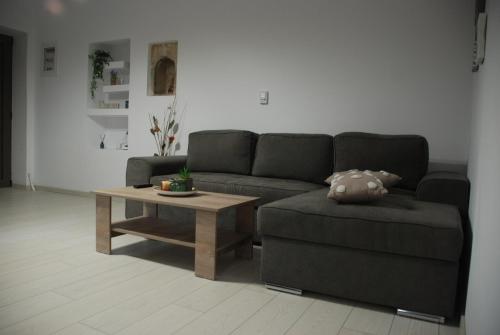 a living room with a couch and a coffee table at Aelia in Agios Vlasios