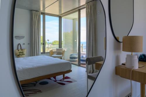 Un ou plusieurs lits dans un hébergement de l'établissement Hôtel de La Plage