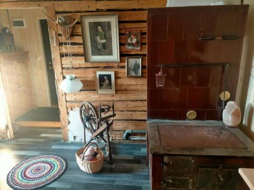 a room with a wooden wall with pictures on it at Lossi 8 Põltsamaa Maida in Põltsamaa