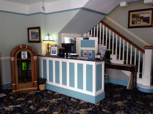 a room with a counter with a computer on it at Hotel Catalina in Avalon