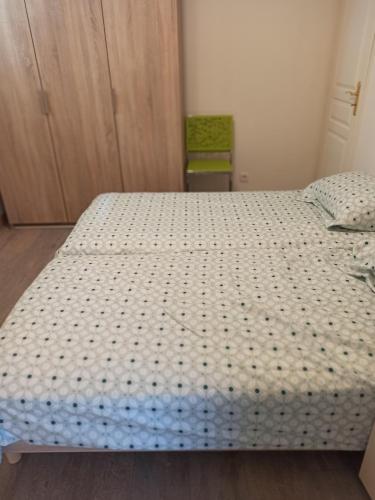 a bedroom with a bed with a white mattress at Joss Nath homes in Melun