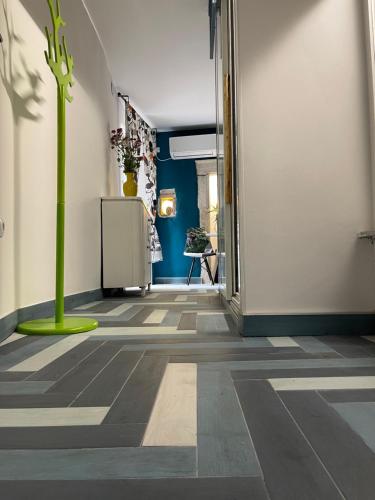 an empty hallway with a green plant in the middle at Apartments Kremenic in Cres