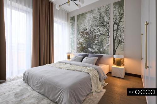 a bedroom with a large bed and a large window at Luxury apartment in the city centre in Tallinn