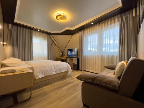 Postel nebo postele na pokoji v ubytování Mr.Liao Hotel