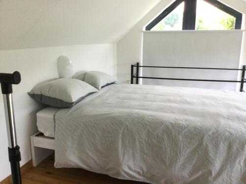 Postel nebo postele na pokoji v ubytování Gîte des Grandsarts