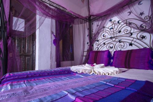 Кровать или кровати в номере Dar Touijar