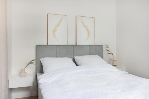 Кровать или кровати в номере Baltic Sands Apartments Premium - Plac Unii