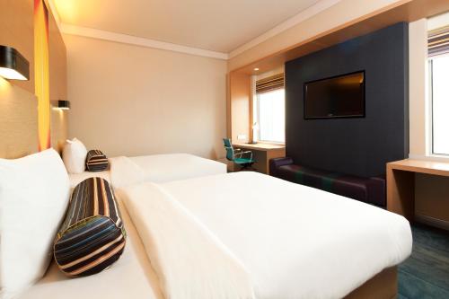 Krevet ili kreveti u jedinici u okviru objekta Funiu Mountain Hotel