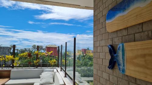 a view from the balcony of a house at Apê Jardins in Flecheiras