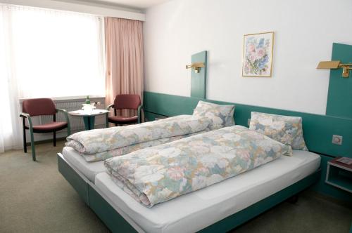 Llit o llits en una habitació de Hotel-Restaurant Sternen