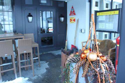 a bunch of vegetables hanging from the side of a building at Hotel-Restaurant Sternen in Nesslau