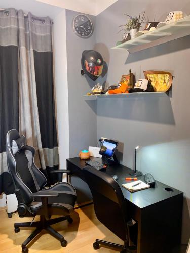an office with a desk and two chairs at Mini Smart Studio - Self Check-in in Graz