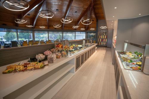 a buffet line with many different types of food at Distinction Luxmore Hotel in Te Anau