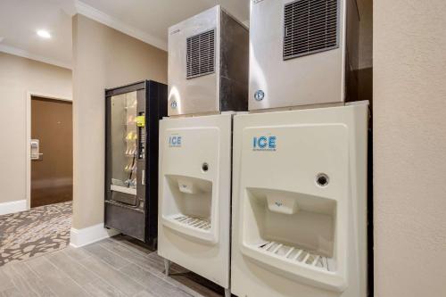 a room with two refrigerators and a refrigerator at Sleep Inn & Suites Niceville - Destin in Niceville