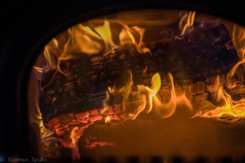 a close up of a fire in a fireplace at Kaszubska Odskocznia Ostoja Bukowo in Borowy Młyn