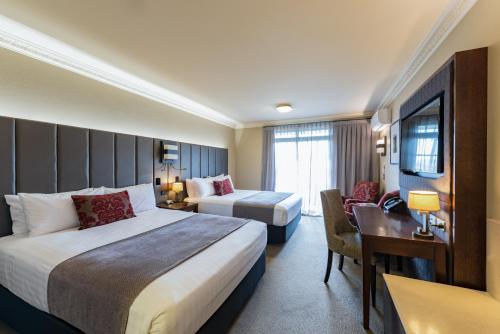 Postel nebo postele na pokoji v ubytování Distinction Hotel Rotorua