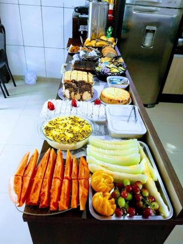 a buffet with different types of food on a table at Guest House Mel & Mar in Penha