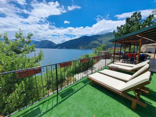 a balcony with a gazebo and a view of a lake at Villa Strp in Risan