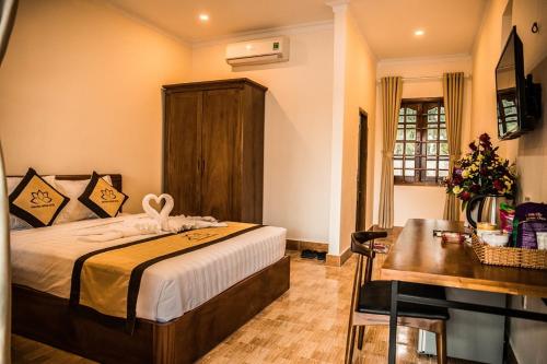 Postel nebo postele na pokoji v ubytování PHƯƠNG NHUNG HOTEL