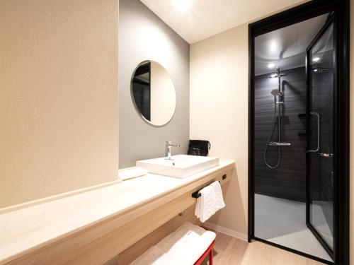 Ett badrum på Hotel JAL City Toyama