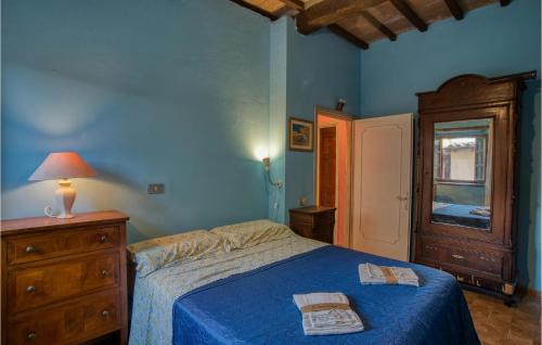 a bedroom with a bed and a dresser and a window at 1 Bedroom Cozy Home In Montegiovi in Montegiovi