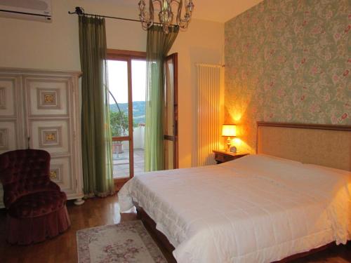 Postel nebo postele na pokoji v ubytování B&B Il Suono del Bosco
