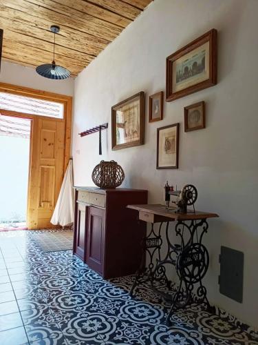 a room with a table and a table and a door at Domek Dírná in Dírná