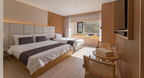 Postel nebo postele na pokoji v ubytování Denbasta forest Hotel