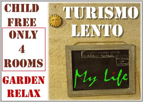 a chalkboard on a wall with signs on it at MyLife B&B Country House in Castellaneta Marina 