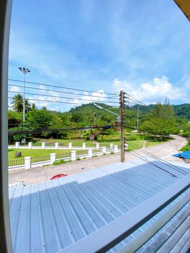 a view from a window of a roof at Khaolak Mind Home Hostel in Khao Lak