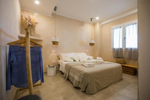 a bedroom with a bed in a room at MORF suites in Casale Marittimo