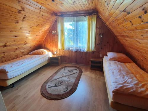Llit o llits en una habitació de Kardaszówka w Polańczyku