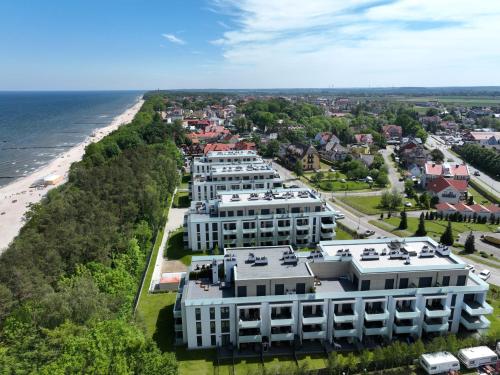 an aerial view of a resort near the beach at Platinium Rewal Aparthotel 19 in Rewal