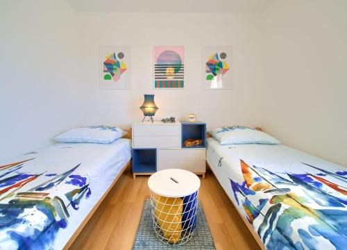 Postel nebo postele na pokoji v ubytování Apartments Aster